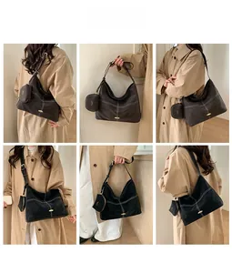 Detail of retro suede tote bags with contrast stitching and detachable mini pouches