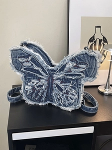 Borsa a spalla a farfalla in denim alla moda con frange bianche e cuciture rosse