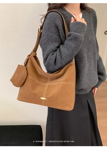 Brown hobo shoulder bag with contrast stitching and matching coin purse detail