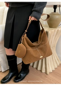 Brown frosted leather Hobo bag with white decorative stitching and gold hardware detail