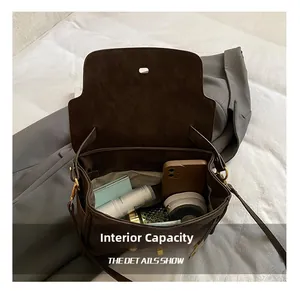 Macro view of the spacious inner compartment showing large storage capacity of the brown bag