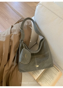 Detail of olive gray tote bag with contrast stitching and small detachable pouch