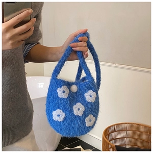Blue plush bucket bag with cute white floral embroidery details and soft knit texture