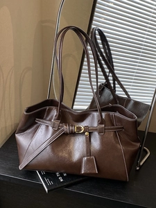 Deep brown retro tote bag with white contrast stitching and gold metal buckles