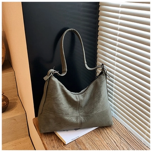 Detailed close-up of olive green vintage leather bag with matte texture and fine stitching