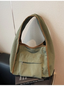 Olive green corduroy tote bag with brown trim and front zipper pocket for daily commute