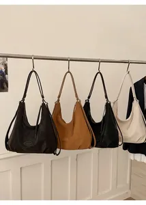 Selection of large Hobo shoulder bags in dark brown, camel, black, and cream leather colors