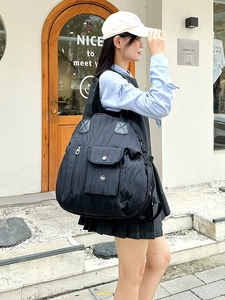 Minimalist black pleated nylon backpack with large capacity and multi-pocket casual design
