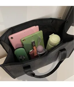 Top view showing the large capacity and spacious storage of the black checkered tote bag