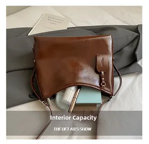Detailed view of the brown oil-wax tote interior showing capacity for daily essentials