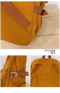 Detailansicht des gelben Nylon-Rucksacks mit Nähten, Riemen und dem DOHERTY-Logo