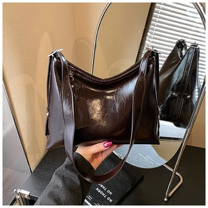 Detailed view of large dark brown oil wax leather hobo bag with adjustable strap
