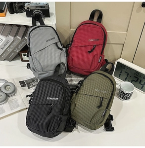 Collection of checkered crossbody bags in gray, red, black, and olive green with straps