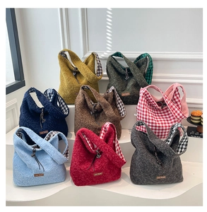 Detailed macro view of assorted plush shearling tote bags in various vibrant colors