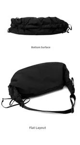 Detailed bottom view of a black nylon dumpling bag featuring a zipper layer and adjustable strap
