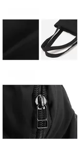 Close-up of durable nylon fabric texture and high-quality metal zipper on a black tote bag