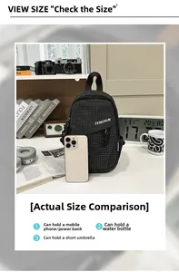 Detail showing internal capacity of the plaid crossbody bag with a smartphone for scale