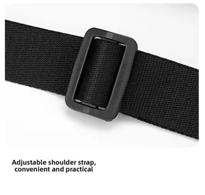 Close-up of adjustable black nylon woven shoulder strap with plastic buckle detail