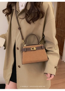 Detail of retro camel crossbody bag featuring a matte texture and metal twist lock closure