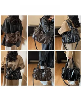 Model wearing vintage punk tote bag with corset lacing and rivets in black and brown