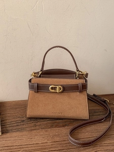 Retro matte leather crossbody bag in dark brown with contrast stitching and gold buckle