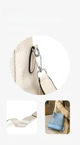 Detail of high-density detachable strap and silver metal hook on stylish backpack