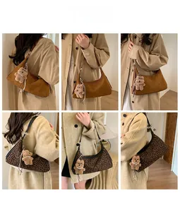 Detail shots of brown suede and leopard print hobo bags with cute bear charms