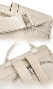 Close-up of durable metal buckles and neat stitching on a beige fashion backpack