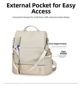 Macro view of beige travel backpack featuring front zipper pockets and side storage