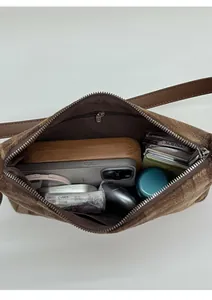 Interior view of brown plush tote bag showing large capacity for daily essentials