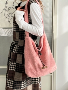 Pink plush tote bag for women featuring a teddy fleece texture and drawstring side details