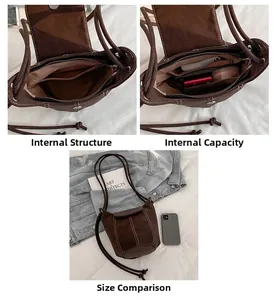 Detail of brown vintage bucket bag interior compartments and storage capacity view