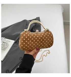 Chic brown suede bag with white dots featuring gold handle and rhinestone clasp detail