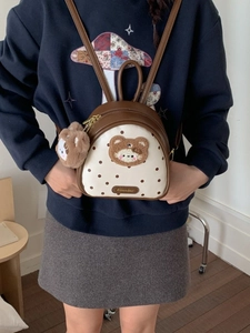 Mini brown polka dot backpack for women with cute plush bear patch and charm accessory