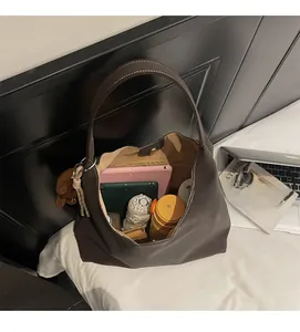Interior detail of large tote bag showing ample space for tablet and daily items