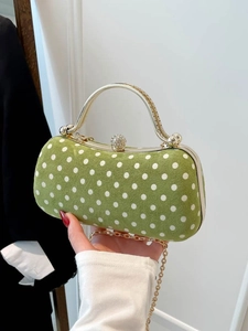 Elegant green velvet polka dot evening bag with gold handle and sparkling rhinestone clasp