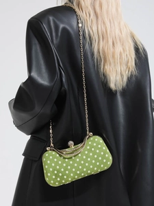 Chic green polka dot crossbody box bag with gold chain strap and velvet finish