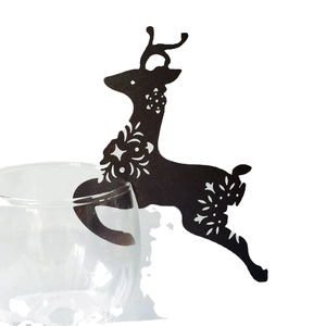 Laser-cut black reindeer cup card with snowflake patterns for Christmas table decor