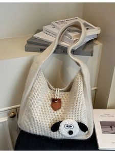 Minimalist beige knitted tote bag with cute cartoon dog patch and toggle closure