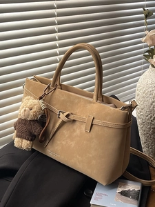 Khaki suede-textured tote bag with elegant bear pendant and detachable shoulder strap