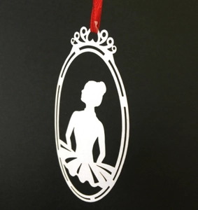 Laser-cut white ballerina silhouette ornament with crown detail and red hanging ribbon