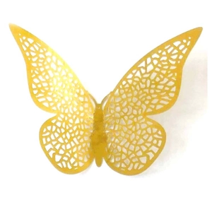 Close-up of golden hollow butterfly decorations with intricate laser-cut patterns