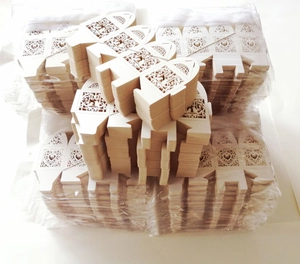 Laser cut ivory paper gift box with hollow heart patterns for wedding party favors