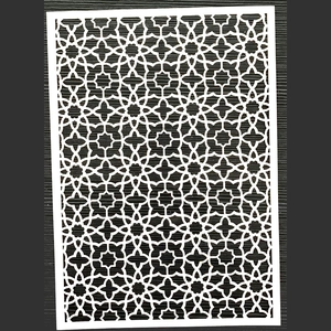 Laser-cut white geometric stencil with intricate floral patterns for DIY scrapbooking craft