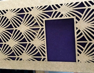 Laser cut kraft paper gift box with geometric floral pattern and rectangular window