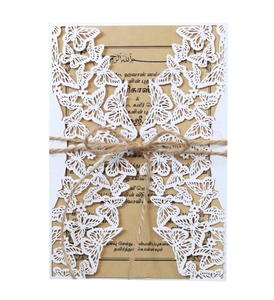 Laser cut butterfly wedding invitation with white outer shell and kraft paper insert
