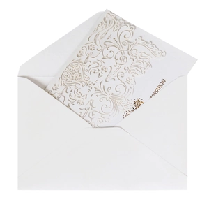 Elegant laser-cut wedding invitation card with intricate floral hollow patterns and white envelope