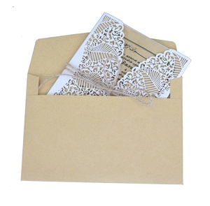 Laser-cut white floral hollow invitation set with kraft envelope and rustic twine cord