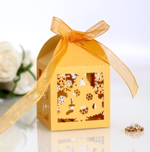 Golden Christmas candy box featuring hollow-out laser cut trees and snowflake details