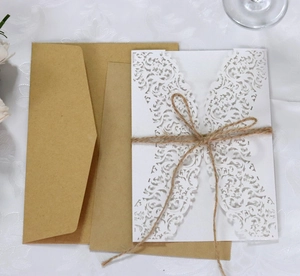 Elegant laser-cut floral wedding invitation set with kraft envelope and jute twine